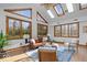 Bright living room with multiple windows, hardwood floors, and comfortable seating at 98 Highland Manor S Ct, Indianapolis, IN 46228
