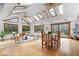 Bright, airy living room with wood floors, skylights, and ample seating overlooking the outdoors at 98 Highland Manor S Ct, Indianapolis, IN 46228
