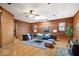 Open living room with hardwood floors, a wood stove, and lots of natural light at 98 Highland Manor S Ct, Indianapolis, IN 46228