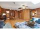 Inviting log cabin living room featuring wood walls, hardwood floors, and a cozy area rug at 98 Highland Manor S Ct, Indianapolis, IN 46228