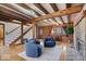 Inviting living room features a striking wood ceiling, log walls, and comfortable seating near the fireplace at 98 Highland Manor S Ct, Indianapolis, IN 46228