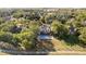A stunning aerial view of a backyard with a large inground pool, and expansive lush green surroundings at 1143 N Sugar Bend Run, Greenfield, IN 46140