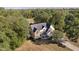 Aerial shot of home with mature landscaping, a long driveway, and a well-manicured lawn at 1143 N Sugar Bend Run, Greenfield, IN 46140