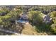 An elevated view of a neighborhood home featuring a large inground pool and tree-lined surroundings at 1143 N Sugar Bend Run, Greenfield, IN 46140