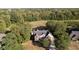 Stunning aerial view of a beautiful home surrounded by mature trees and landscaping at 1143 N Sugar Bend Run, Greenfield, IN 46140