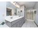 Spacious bathroom with double sinks, tile floors, and a glass-enclosed shower at 1143 N Sugar Bend Run, Greenfield, IN 46140