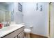 Well-lit half bathroom features a modern sink and walk-in shower at 1143 N Sugar Bend Run, Greenfield, IN 46140