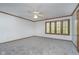 Bright bedroom featuring a ceiling fan and a window with wooden trim at 1143 N Sugar Bend Run, Greenfield, IN 46140