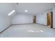 Spacious bonus room featuring an open floor plan and skylights at 1143 N Sugar Bend Run, Greenfield, IN 46140
