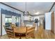 Bright dining area with a wooden table, chandelier, and views of the backyard at 1143 N Sugar Bend Run, Greenfield, IN 46140
