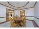 Spacious dining room featuring a beautiful chandelier and adjacent living spaces at 1143 N Sugar Bend Run, Greenfield, IN 46140