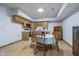 Kitchenette with wood cabinets, dining table, and plenty of natural light at 1143 N Sugar Bend Run, Greenfield, IN 46140