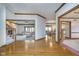 Spacious open-concept living room and dining room with hardwood floors and lots of natural light at 1143 N Sugar Bend Run, Greenfield, IN 46140