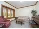 Cozy living room features natural light, comfortable seating, and a stylish piano at 1143 N Sugar Bend Run, Greenfield, IN 46140