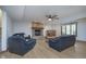 Cozy living room boasts a brick fireplace, comfortable seating, and wood-look floors at 1143 N Sugar Bend Run, Greenfield, IN 46140