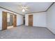 Open main bedroom with two entryways and neutral carpet flooring at 1143 N Sugar Bend Run, Greenfield, IN 46140