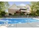 Fenced in swimming pool with slide, spacious patio, and multi-level deck, perfect for outdoor enjoyment at 1143 N Sugar Bend Run, Greenfield, IN 46140
