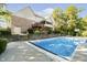 Large swimming pool in the backyard, adjacent to a multi-level deck and patio area at 1143 N Sugar Bend Run, Greenfield, IN 46140