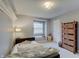 Bedroom with neutral paint, carpet, a window seat, a dresser, and built-in shelving at 1401 Shadow Ct, Zionsville, IN 46077