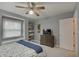Bedroom featuring a large window seat, closet, carpet, wooden dresser and soft, neutral paint at 1401 Shadow Ct, Zionsville, IN 46077