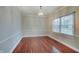 Elegant dining room with hardwood floors, decorative molding, and a chandelier, perfect for gatherings at 1401 Shadow Ct, Zionsville, IN 46077