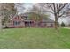 Charming two-story brick home with a well-manicured lawn and mature trees in a desirable neighborhood at 1401 Shadow Ct, Zionsville, IN 46077