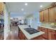 Spacious kitchen with granite countertops, stainless steel appliances, and an island cooktop at 1401 Shadow Ct, Zionsville, IN 46077