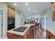 Open kitchen featuring wood cabinets, granite counters, and views into the living room at 1401 Shadow Ct, Zionsville, IN 46077