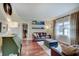Bright living room featuring hardwood floors, stylish decor, and a glimpse of the office at 1401 Shadow Ct, Zionsville, IN 46077