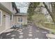 A spacious side yard with pavers and fresh mulch, perfect for gardening or outdoor activities at 1401 Shadow Ct, Zionsville, IN 46077