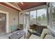 Relaxing screened-in porch with comfortable seating, wood ceiling and an open view of the backyard, perfect for leisure at 1401 Shadow Ct, Zionsville, IN 46077