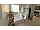 Bathroom featuring a soaking tub, glass-enclosed shower, and neutral tile flooring at 1407 Aggie Ln, Indianapolis, IN 46260