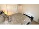 Simple bedroom featuring neutral colored walls, a plush bed, and a double door closet at 1407 Aggie Ln, Indianapolis, IN 46260