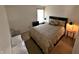 Neutral bedroom featuring a cozy bed, side tables and a television for relaxation at 1407 Aggie Ln, Indianapolis, IN 46260