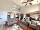 Expansive living room showcasing an open floor plan and abundant natural light with views to the kitchen and billiard room at 1407 Aggie Ln, Indianapolis, IN 46260