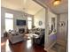 Inviting living room boasts hardwood floors, high ceilings, and a cozy fireplace at 1407 Aggie Ln, Indianapolis, IN 46260