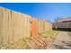 A backyard wood fence gate with address number provides access to the property at 142 Norbeck Ter, Indianapolis, IN 46217