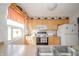 Functional kitchen with wood cabinets, modern appliances, and a view from the sink at 142 Norbeck Ter, Indianapolis, IN 46217