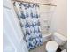 Bathroom featuring a shower with nautical themed curtain and toilet at 14241 Antiquity Dr, Carmel, IN 46033