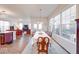 Formal dining room with a dining table, large windows, and view to the living room at 14241 Antiquity Dr, Carmel, IN 46033