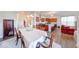 Open concept dining room with a table, view to the kitchen and living room at 14241 Antiquity Dr, Carmel, IN 46033