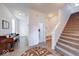 Bright foyer featuring a staircase, hardwood floors, and ample natural light at 14241 Antiquity Dr, Carmel, IN 46033