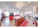 Open concept kitchen featuring an island, stainless steel appliances, and a view to the living and dining rooms at 14241 Antiquity Dr, Carmel, IN 46033