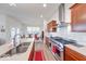 Well-equipped kitchen with stainless steel appliances, tile backsplash, and breakfast nook dining area at 14241 Antiquity Dr, Carmel, IN 46033