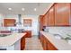 Spacious kitchen featuring wood cabinets, stainless steel appliances, and sleek countertops at 14241 Antiquity Dr, Carmel, IN 46033