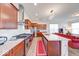 Stylish kitchen with a center island, stainless steel appliances, and seamless integration to the living room at 14241 Antiquity Dr, Carmel, IN 46033