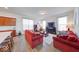 Cozy living room with comfortable seating, a fireplace, and bright windows at 14241 Antiquity Dr, Carmel, IN 46033