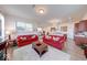Open-concept living room flowing into the kitchen and dining areas, perfect for entertaining at 14241 Antiquity Dr, Carmel, IN 46033