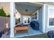 Relaxing covered patio with string lights, a grill, and a well-organized plant display at 14241 Antiquity Dr, Carmel, IN 46033