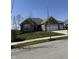Beautifully landscaped single-story brick home with lush green lawn and mature trees at 15085 Thoroughbred Dr, Fishers, IN 46040